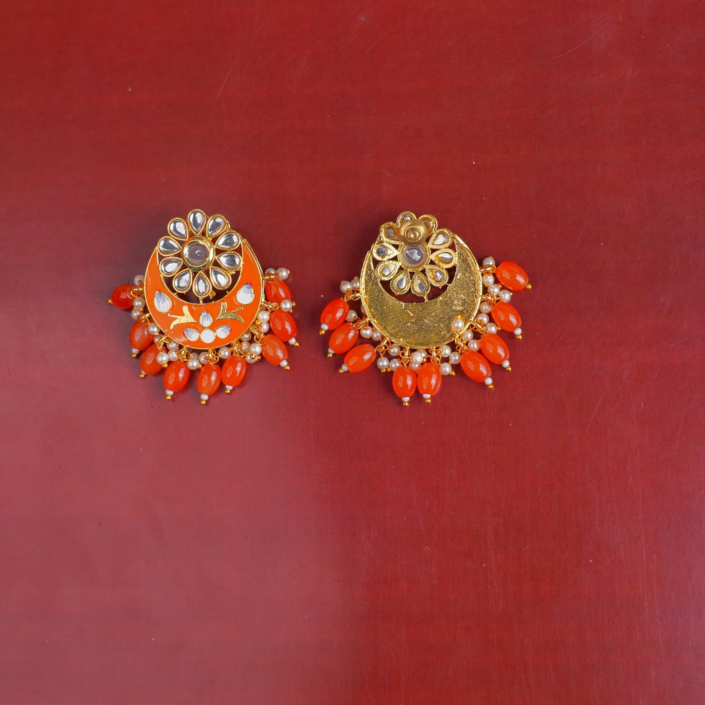 Aarvi- Stone Studded Dangler Earrings(Orange)